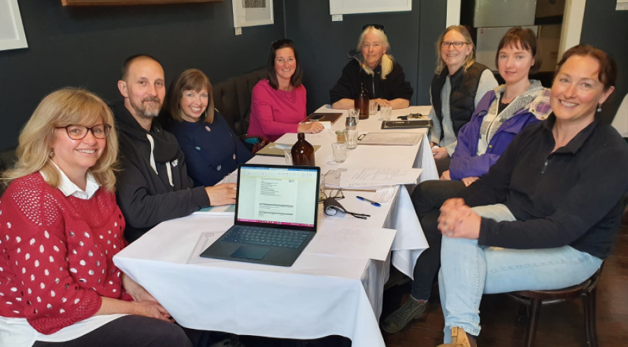 Members of the Ballarat Action network gathered around a table